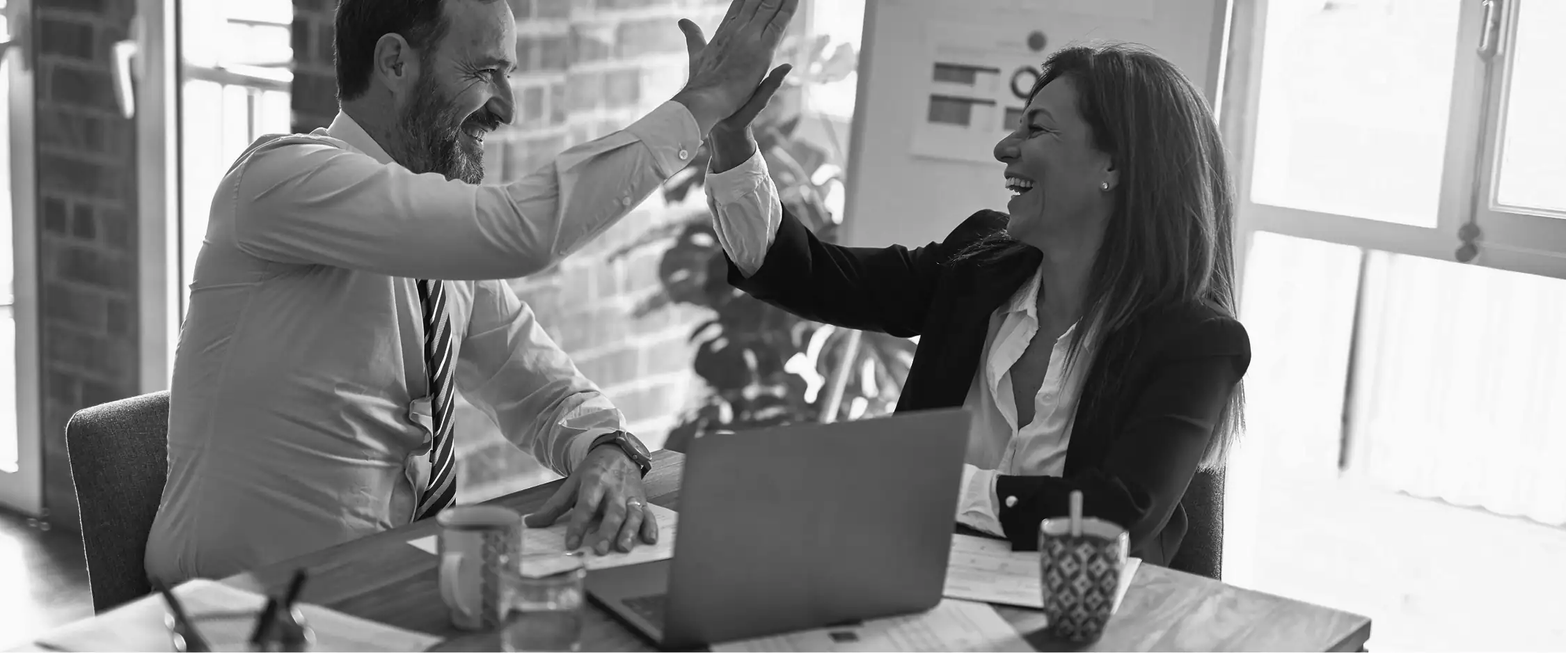 Two colleagues celebrating after a collaborative training session